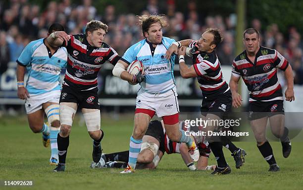 Andy Goode of Worcester is tackled by Gavin Cattle and Philip Burgess during the RFU Championship playoff final 1st Leg match between Cornish Pirates...