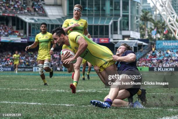 Brandon Quinn of Australia score a try during Challenge Trophy Semi Finals between Scotland and Australia on day three of the Cathay Pacific/HSBC...