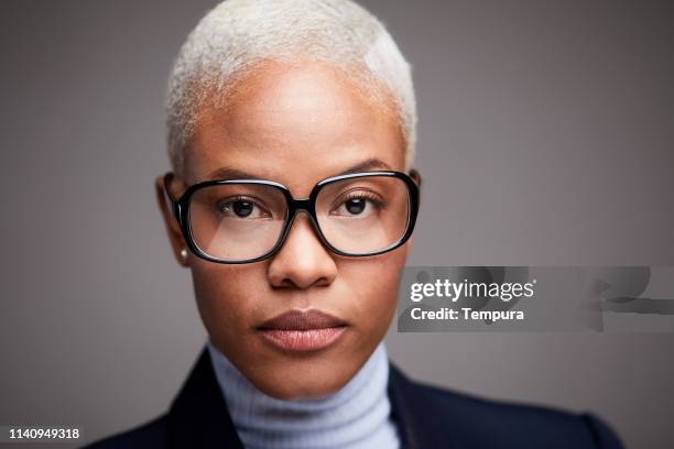 businesswoman studio head shot. - black suit close up stock pictures, royalty-free photos & images