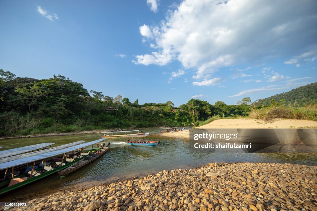 Boat is a main transportation in tropical rain forest landscape at Taman Negara, Pahang, Malaysia.