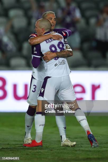 Jason Davidson of Perth Glory hugs team mate Neil Kilkenny after a goal during the round 24 A-League match between the Central Coast Mariners and the...
