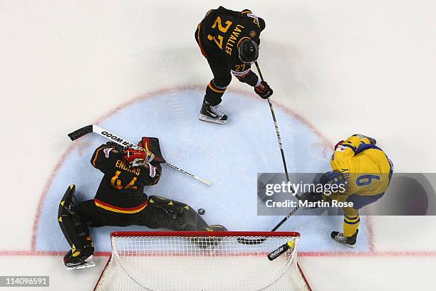 Mattias Tedenby of Sweden fails to score over Dennis Endras , goaltender of Germany during the IIHF World Championship quarter final match between...