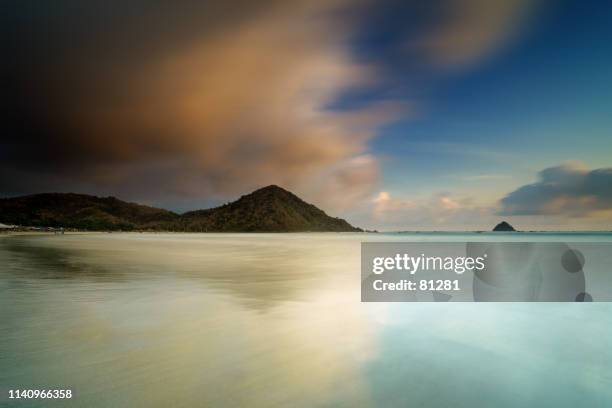 selong belanak beach contrasts, lombok, west nusa tenggara,  indonesia - split screen ストックフォトと画像