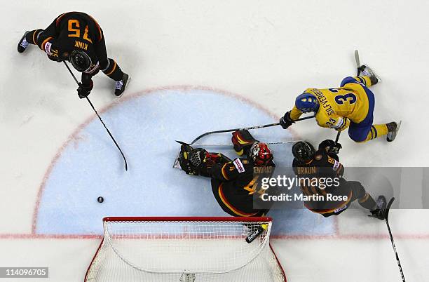 Jakob Silfverberg of Sweden fails to score over Dennis Endras , goaltender of Germany during the IIHF World Championship quarter final match between...