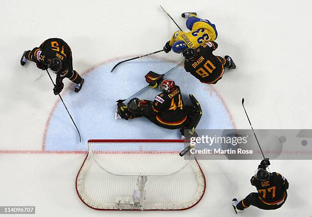 Jakob Silfverberg of Sweden fails to score over Dennis Endras , goaltender of Germany during the IIHF World Championship quarter final match between...