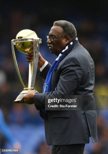 Former West Indies Cricketer, Clive Lloyd poses with the Cricket World Cup Trophy prior to the Premier League match between Everton FC and Arsenal FC...