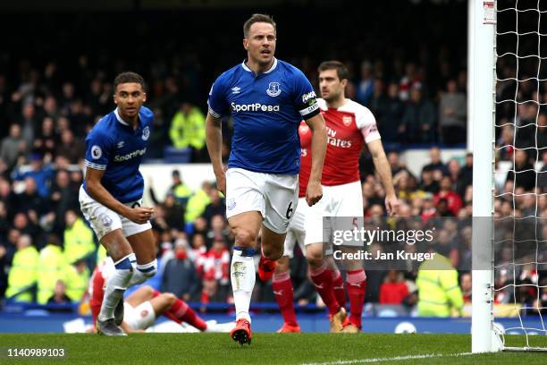 Phil Jagielka of Everton celebrates after scoring his team's first goal during the Premier League match between Everton FC and Arsenal FC at Goodison...