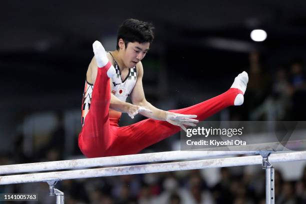 Kenzo Shirai of Japan competes in the Men's Parallel Bars during the FIG Artistic Gymnastics All-Around World Cup Tokyo at Musashino Forest Sport...