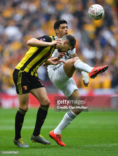 Craig Cathcart of Watford and Raul Jimenez of Wolverhampton Wanderers battle for the ball during the FA Cup Semi Final match between Watford and...