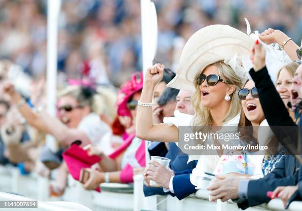 Racegoers watch the racing on day 3 'Grand National Day' of The Randox Health Grand National Festival at Aintree Racecourse on April 6, 2019 in...