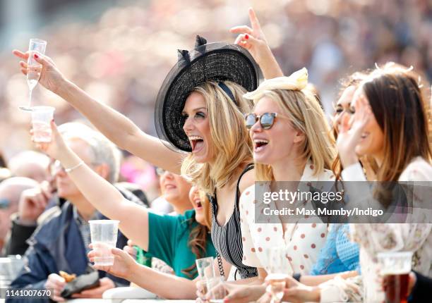 Racegoers watch the racing on day 3 'Grand National Day' of The Randox Health Grand National Festival at Aintree Racecourse on April 6, 2019 in...