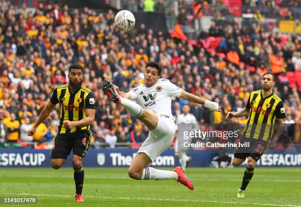 Danny Batth of Wolverhampton Wanderers stretches for the ball ahead of Adrian Mariappa of Watford during the FA Cup Semi Final match between Watford...