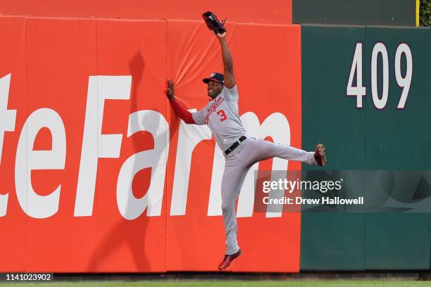 Michael A. Taylor of the Washington Nationals catches a fly ball at the wall against the Philadelphia Phillies at Citizens Bank Park on May 3, 2019...