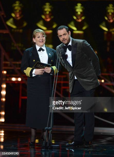 Danny Dyer and Cunard Captain Inger Klein Thorhauge on stage during The Olivier Awards 2019 with Mastercard at the Royal Albert Hall on April 07,...