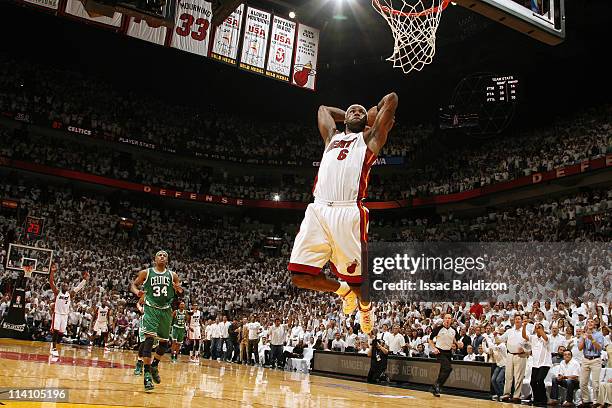 LeBron James of the Miami Heat dunks against Paul Pierce of the Boston Celtics in Game Five of the Eastern Conference Semifinals in the 2011 NBA...