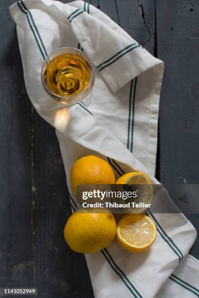 glass of wine with lemon - tea towels stock pictures, royalty-free photos & images