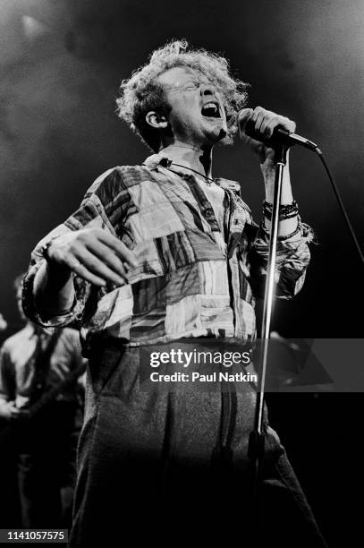 English Pop and R&B singer Mick Hucknall, of the group Simply Red, performs onstage at the Park West, Chicago, Illinois, August 5, 1986.