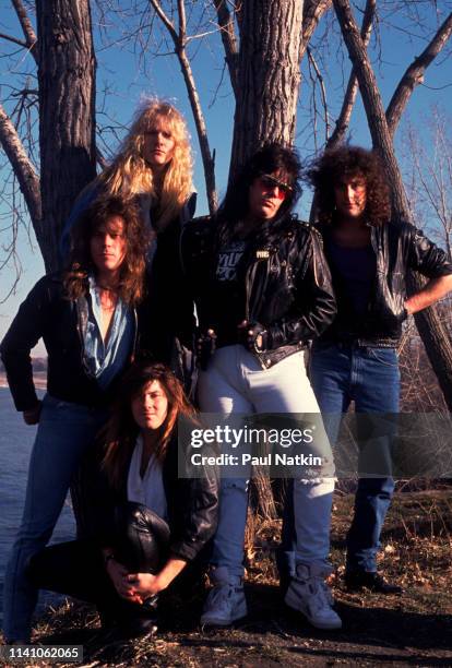 Portrait of American Rock group Shok Paris as they pose outdoors, Cleveland, Ohio, September 15, 1987. Pictured are, from left, Danny Simmons, Eric...