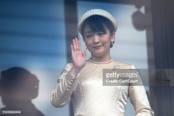 Princess Mako waves after listening to Emperor Naruhito of Japan make his first public speech from the balcony of the Imperial Palace on May 4, 2019...