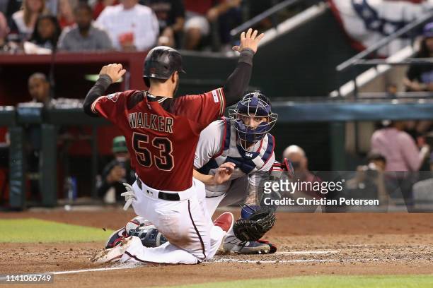Catcher Blake Swihart of the Boston Red Sox tags out the sliding Christian Walker of the Arizona Diamondbacks during the fifth inning of the MLB game...