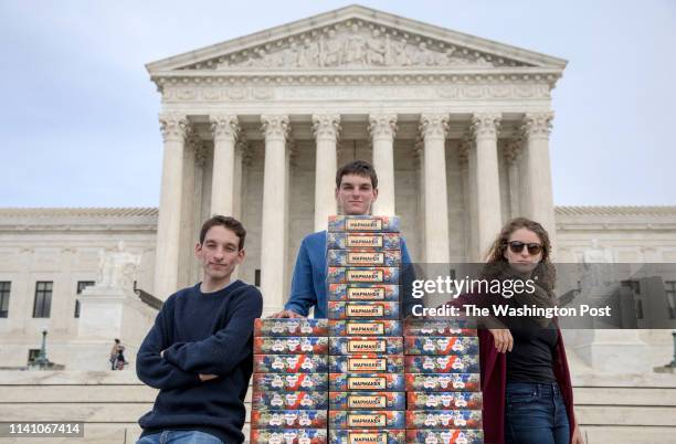 Seventeen-year-old Josh Lafair, a board-game fanatic and political activist, along with his siblings Louis and Rebecca, stack 82 copies of the game...