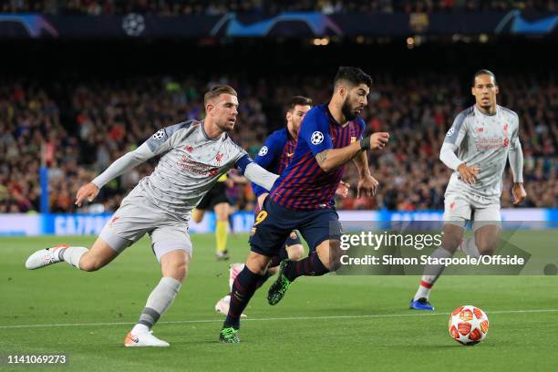 Luis Suarez of Barcelona battles with Jordan Henderson of Liverpool during the UEFA Champions League Semi Final first leg match between FC Barcelona...