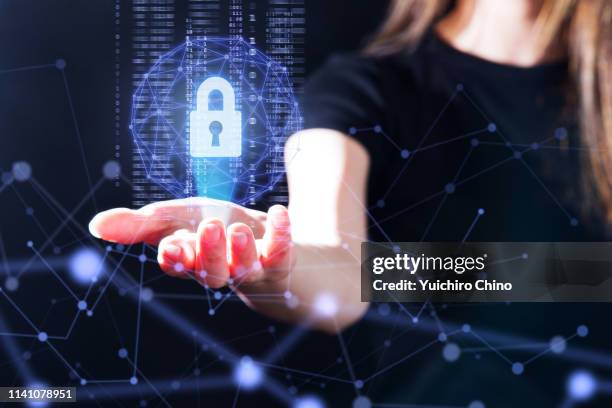 the gesture interface technology with the security key lock icon and binary - safe data stockfoto's en -beelden