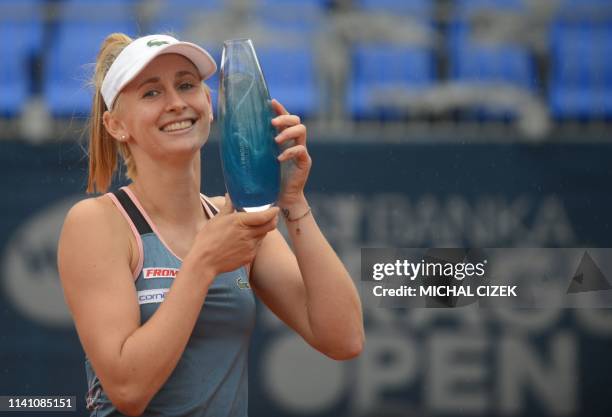 Switzerland's Jil Teichmann poses with her trophy after winning over Czech Republic's Karolina Muchova their final match at the WTA Prague tennis...