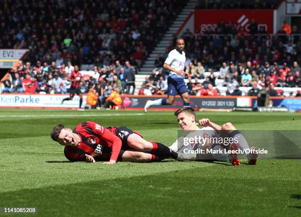 Jack Simpson of Bournemouth is fouled by Juan Foyth of Tottenham who received a red card for the bad tackle during the Premier League match between...