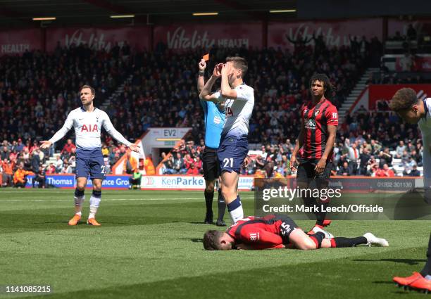 Jack Simpson of Bournemouth is fouled by Juan Foyth of Tottenham who received a red card for the bad tackle during the Premier League match between...