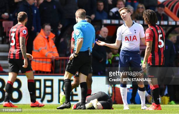 Tottenham Hotspur's Argentinian defender Juan Foyth remonstrates with referee Craig Pawson after receiving a red card for his challenge on...