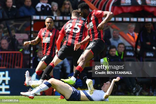 Tottenham Hotspur's Argentinian defender Juan Foyth vies with Bournemouth's English defender Jack Simpson and Bournemouth's Colombian midfielder...