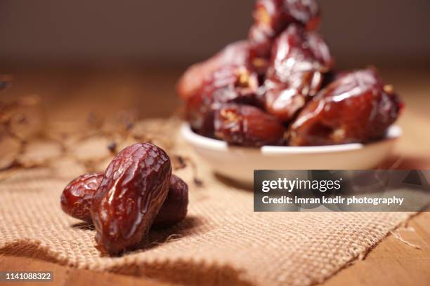 dates fruit in selective focus - date fruit stock pictures, royalty-free photos & images