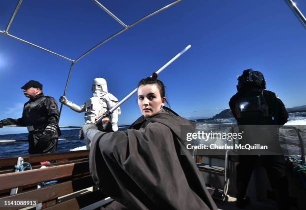 Members of the 501st Legion Ireland Garrison dressed as the Star Wars characters Rey, an Imperial officer, a TIE Fighter pilot and a Snowtrooper pose...