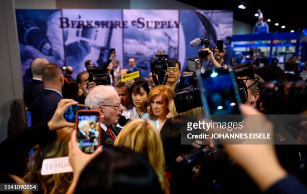 Warren Buffett , CEO of Berkshire Hathaway, speaks to the press as he arrives at the 2019 annual shareholders meeting in Omaha, Nebraska, May 4, 2019.