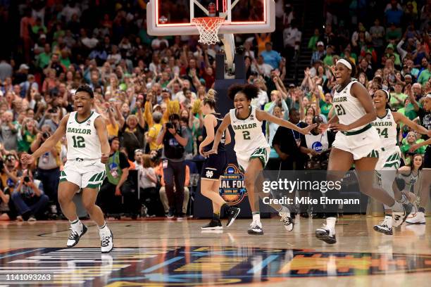 Moon Ursin, DiDi Richards and Kalani Brown of the Baylor Lady Bears celebrate their 82-81 win over the Notre Dame Fighting Irish to win the...