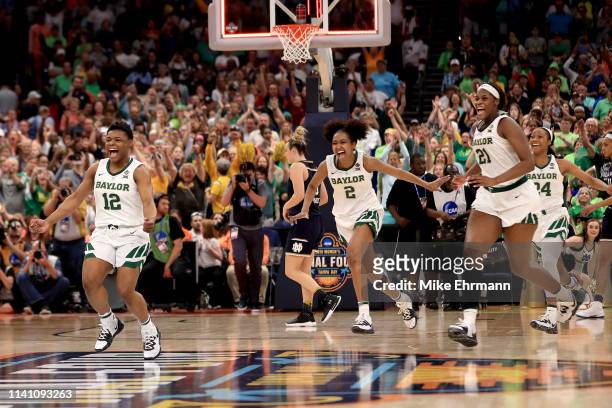 Moon Ursin, DiDi Richards and Kalani Brown of the Baylor Lady Bears celebrate their 82-81 win over the Notre Dame Fighting Irish to win the...