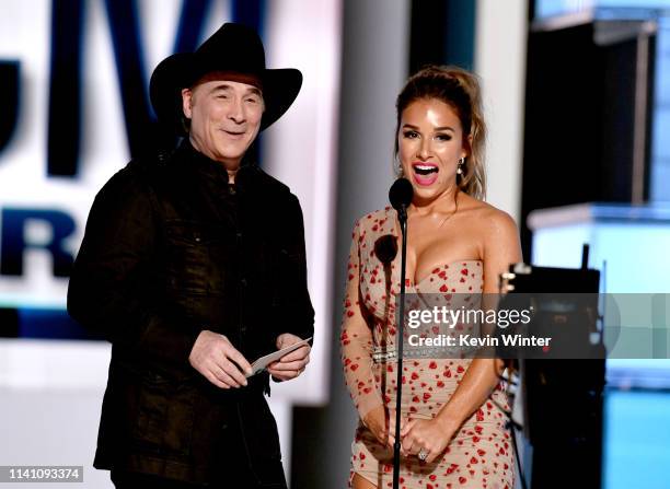 Clint Black and Jessie James Decker speak onstage during the 54th Academy Of Country Music Awards at MGM Grand Garden Arena on April 07, 2019 in Las...