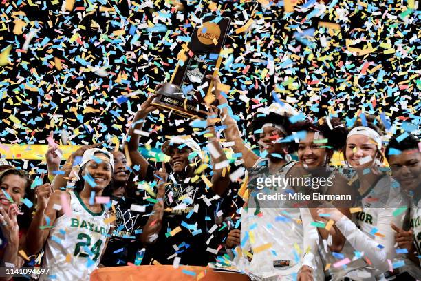 The Baylor Lady Bears celebrate with the NCAA trophy after their teams 82-81 win over the Notre Dame Fighting Irish to win the championship game of...