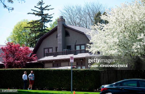 Jay Phoenix Singh and his father Paul Singh walkin front of the house of Warren Buffett, CEO of Berkshire Hathaway on May 2 ahead of the annual...