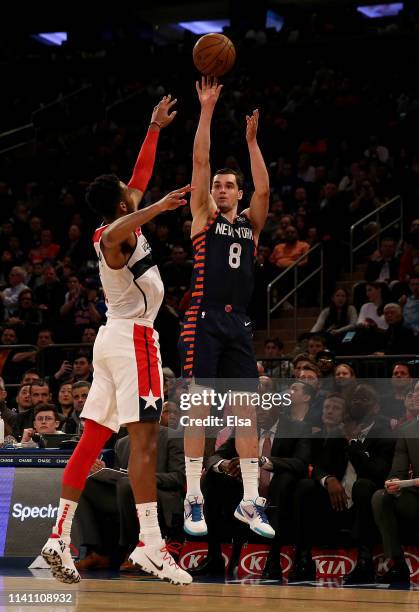 Mario Hezonja of the New York Knicks shoots a three point shot as Troy Brown Jr. #6 of the Washington Wizards defends at Madison Square Garden on...