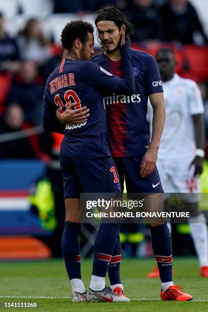 Paris Saint-Germain's Brazilian forward Neymar and Paris Saint-Germain's Uruguayan forward Edinson Cavani react during the French L1 football match...