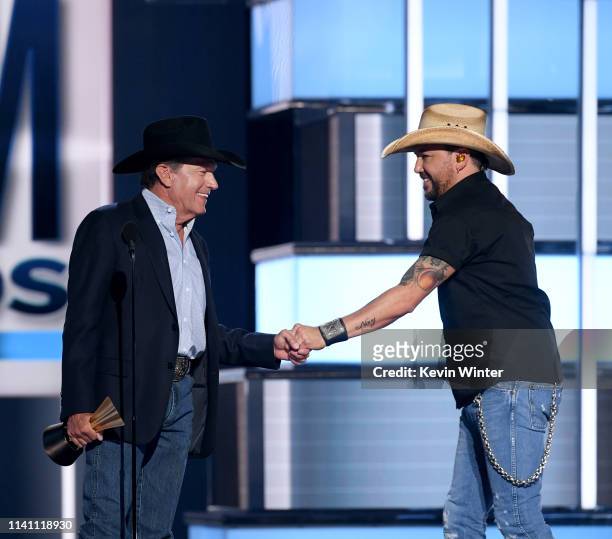 George Strait presents the ACM Dick Clark Artist of the Decade Award to Jason Aldean onstage during the 54th Academy Of Country Music Awards at MGM...