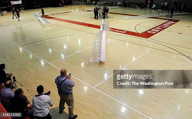 University of Maryland students prepare to test a human-powered helicopter named "Gamera" on Wednesday May 11, 2011 inside an auxiliary gym at the...