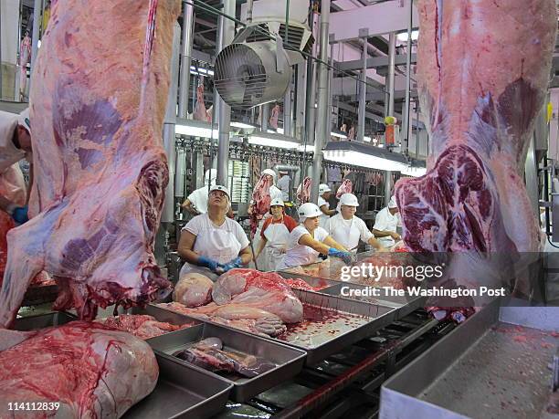 At the JBS meat plant in Lins, workers quickly turn what was once a 1,000-pound steer into more manageable parts that will be turned into corned beef...