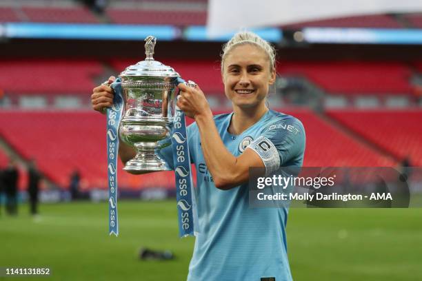 Steph Houghton of Manchester City Women poses with The FA Cup during the Women's FA Cup Final match between Manchester City Women and West Ham United...