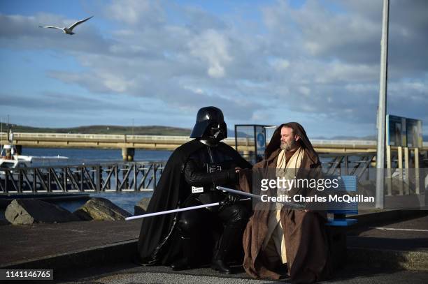 501st Garrison Ireland Leigon members Alan Bell and John O'Dwyer playing the characters Obi Wan Kenobi and Darth Vader sit on a bench on May 4, 2019...