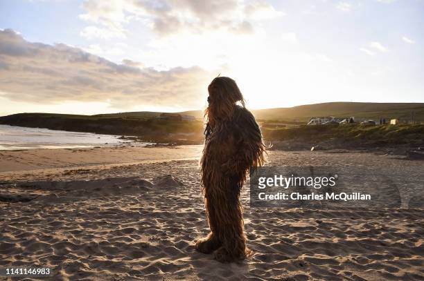Star Wars fan dressed as the character Chewbacca looks out towards Skellig Michael island on May 4, 2019 in Portmagee, Ireland. The latest Star Wars...