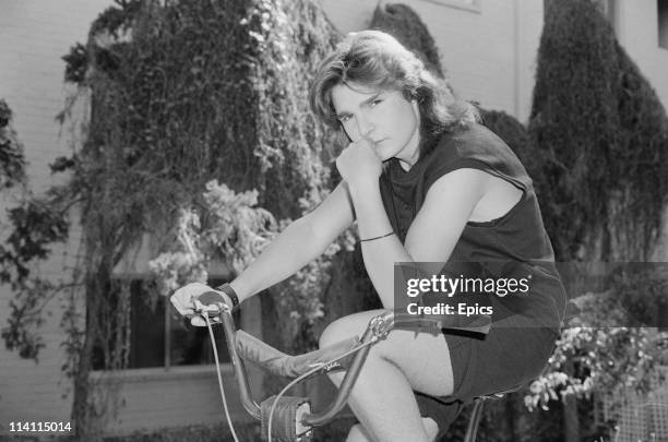 American television and film actor Corey Feldman poses on a bmx bike for a magazine shoot, United States, circa 1985.