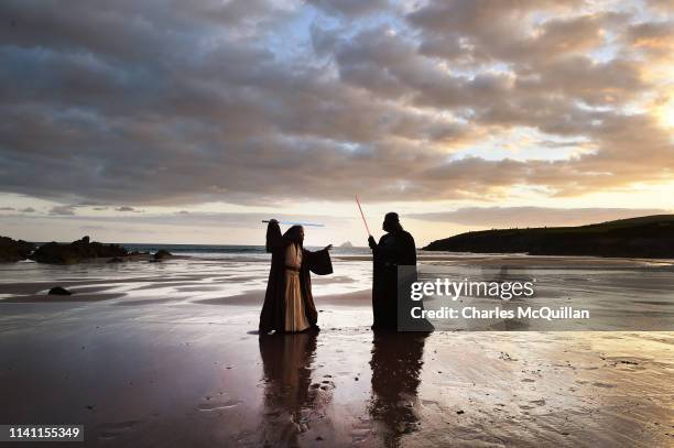 501st Garrison Ireland Leigon members Alan Bell and John O'Dwyer playing the characters Obi Wan Kenobi and Darth Vader cross swords against the...